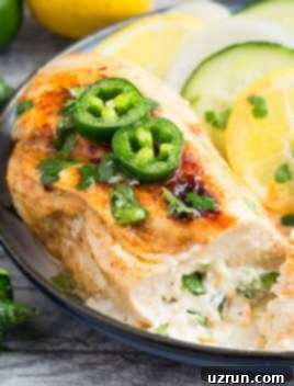 Jalapeno Popper Chicken 6 Easy Stuffed Chicken Breast on White Dish With Black Rim.