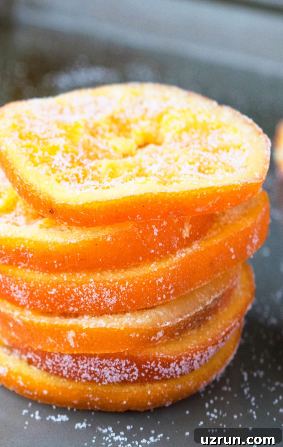 Candied Orange Slices and Peels 4 Stack of Sugared Orange Slices on Gray Tray.