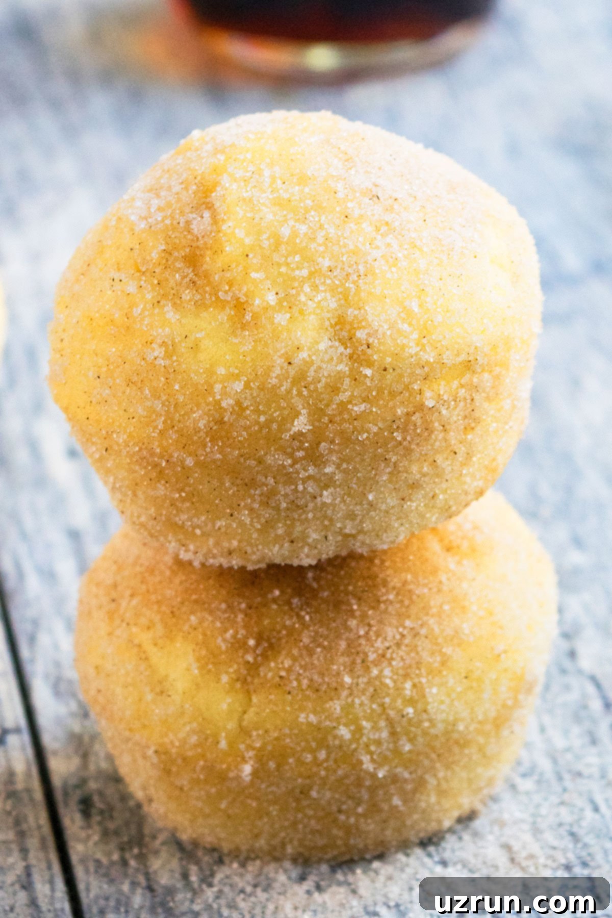 Easy Cinnamon Muffins Stacked on Top of Each Other on Rustic Gray Background.