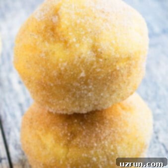 Soft and Moist Cinnamon Muffins 6 Easy Cinnamon Muffins Stacked on Top of Each Other on Rustic Gray Background.