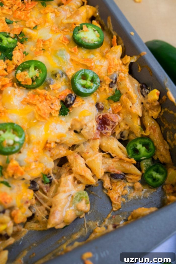 Spicy Chicken Pasta With Jalapeños in Gray Baking Dish. 