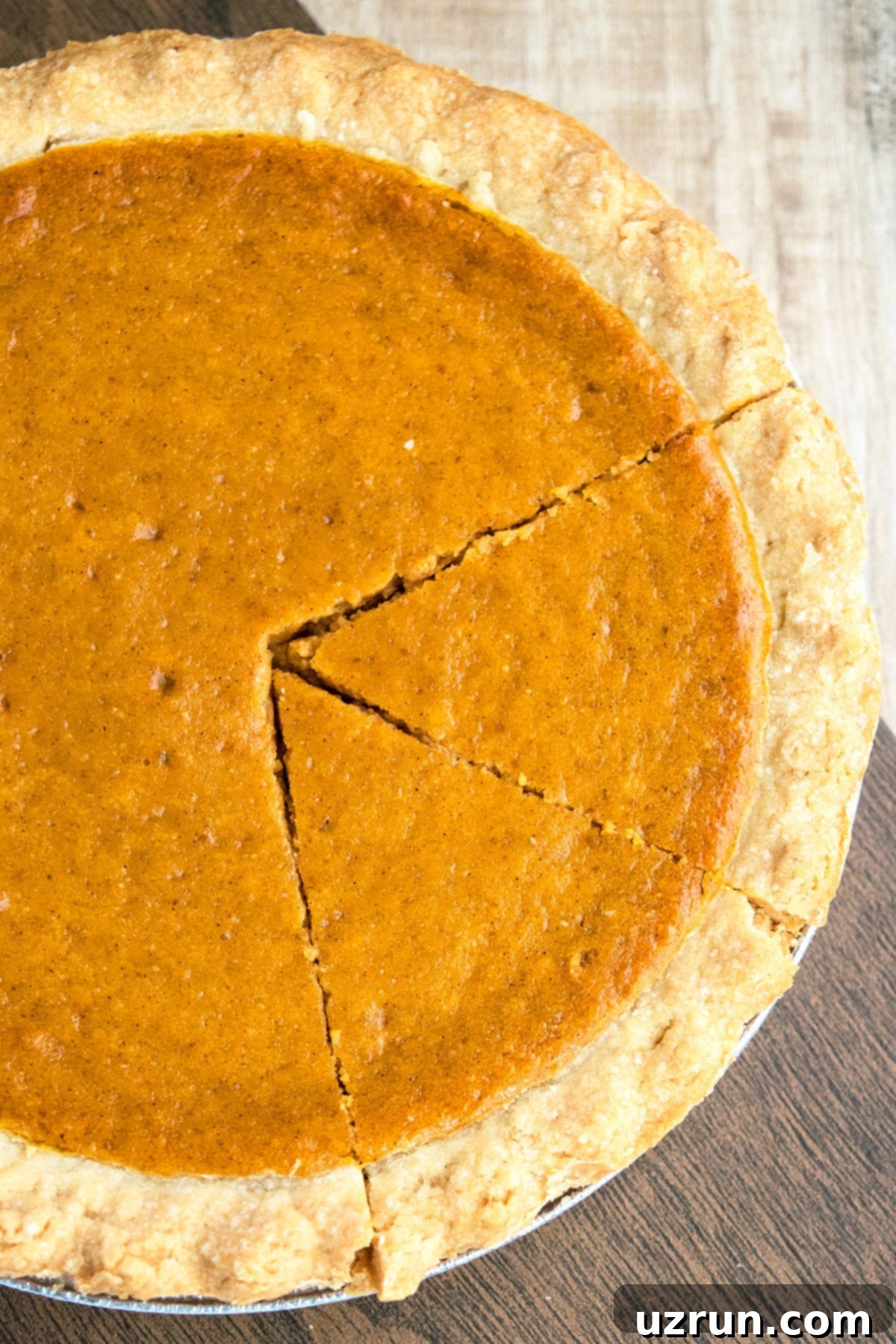 Easy 5 Ingredient Pumpkin Pie 5 Best Thanksgiving Pie on Wood Background- Overhead Shot.