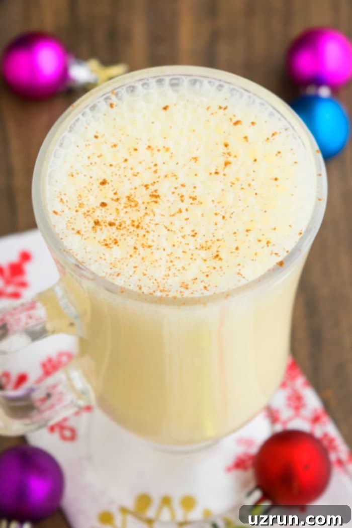 Easy Homemade Eggnog in Glass Mug. A classic holiday beverage.