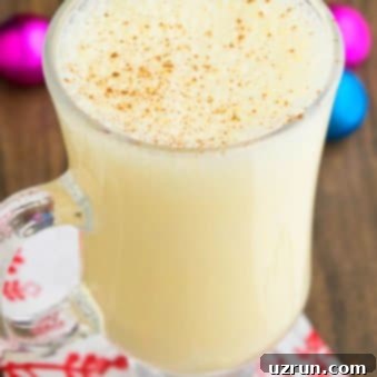 Simple and Creamy Homemade Eggnog 4 Easy Homemade Eggnog in Glass Mug. A delightful non-alcoholic Christmas drink.
