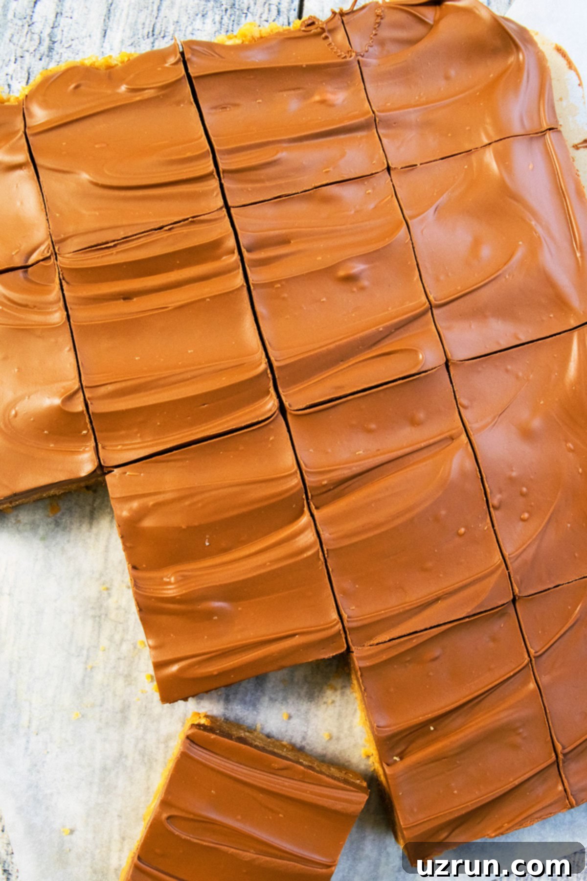 Easy Scotcheroos Without Corn Syrup 5 Overhead Shot of Chocolate Butterscotch Topping on No Bake Bars.