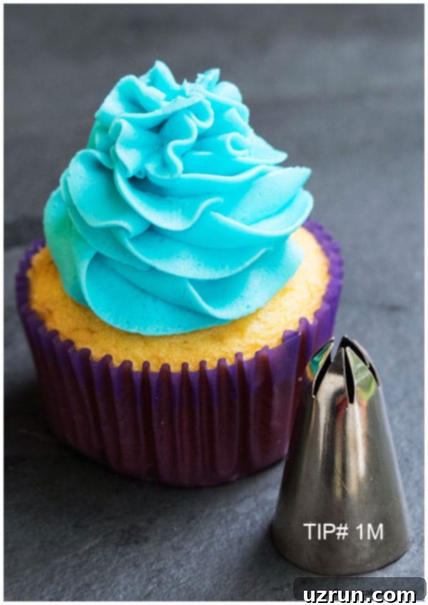 Mastering Cupcake Decoration 4 Cupcake With Blue Buttercream Icing Swirl Made With Pastry Tip 1M on Rustic Gray Background