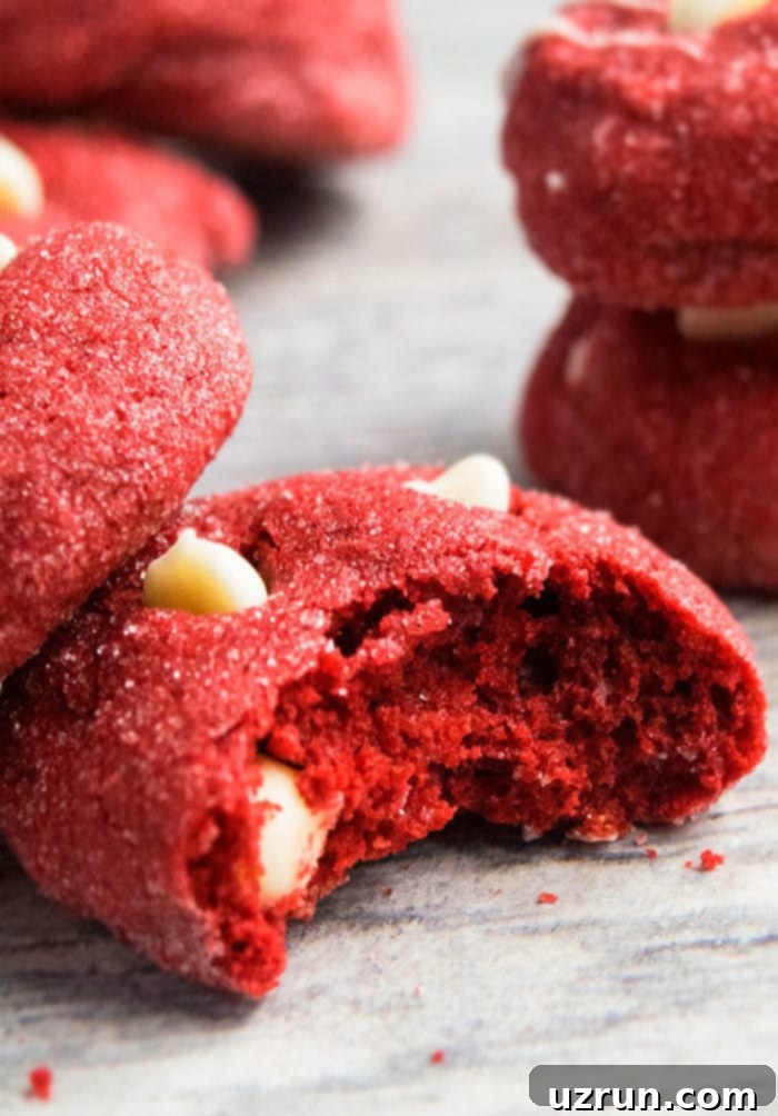 Red Velvet Cake Mix Cookies 4 Partially Eaten White Chocolate Chip Cake Mix Cookies on Rustic Gray Background