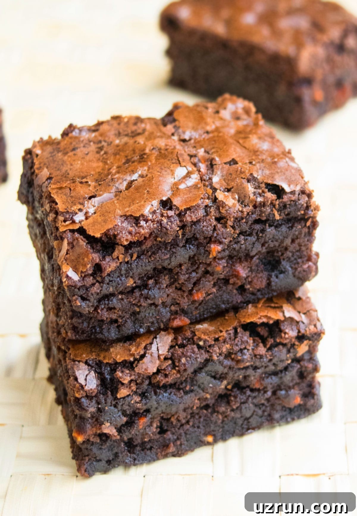 Stack of Easy Carrot Brownies With Box Mix on Wood Background. 