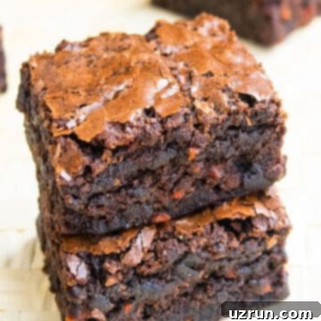 Semi-Homemade Carrot Brownies 11 Stack of Easy Chocolate Carrot Brownies (Carrot Cake Brownies) With Box Mix on Wood Background.