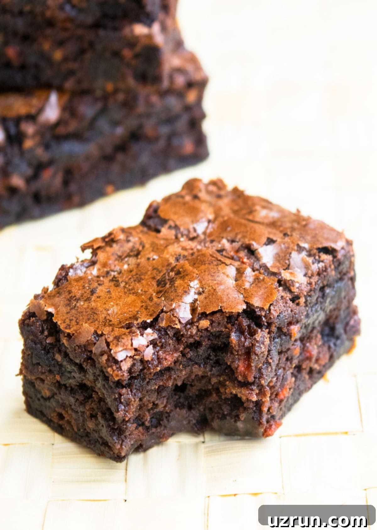 Semi-Homemade Carrot Brownies 3 Partially Eaten Slice of Brownie on Wood Background.