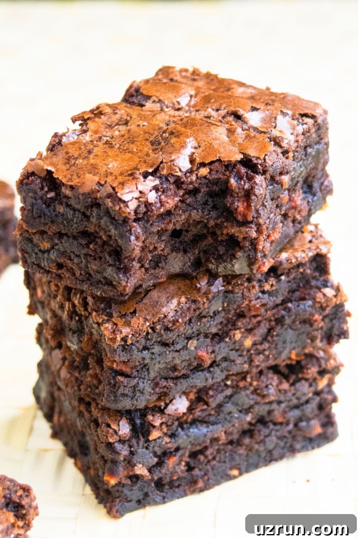 Semi-Homemade Carrot Brownies 10 Stack of Brownies With Top One Partially Eaten.