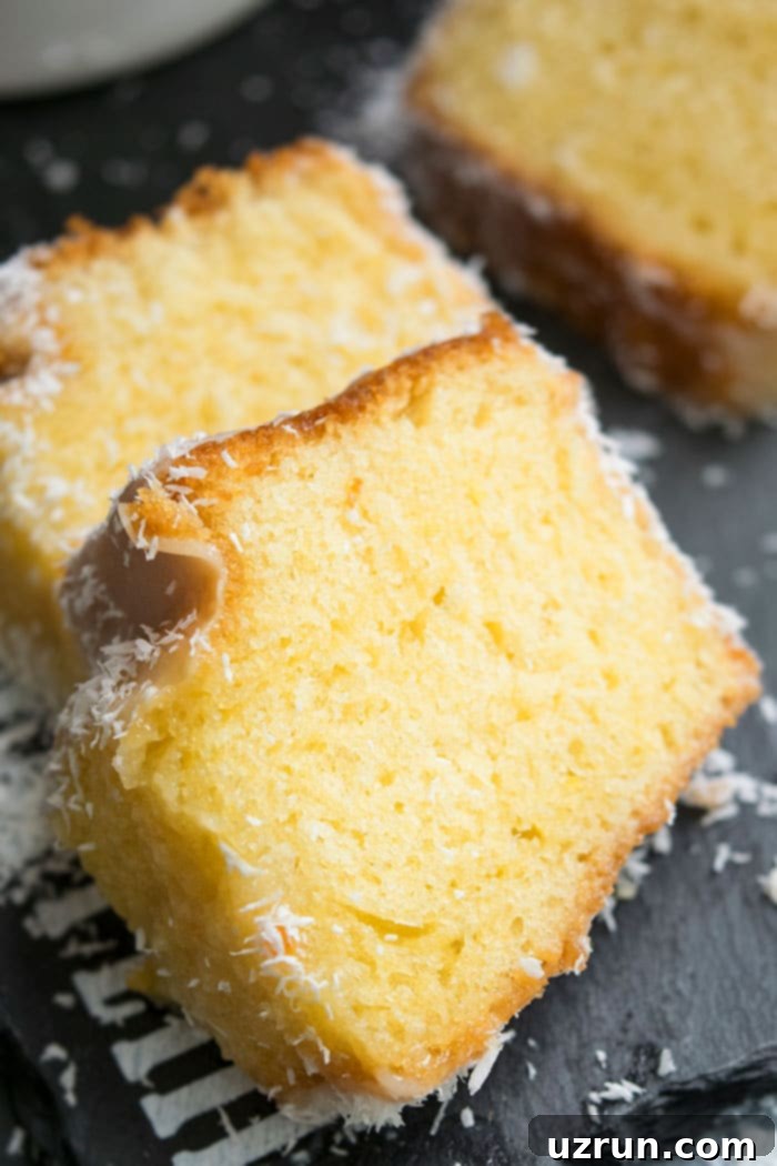 Easy Louisiana Crunch Cake With Cake Mix Slices on a Black Dish