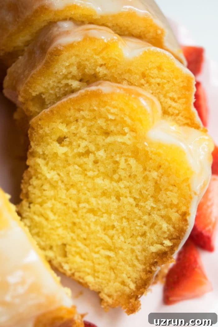 Easy Homemade Lemon Bundt Cake With Cake Mix on White Dish.