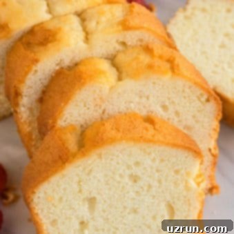 Classic Homemade Buttermilk Pound Cake 5 Slices of Buttermilk Pound Cake on White Marble Background.