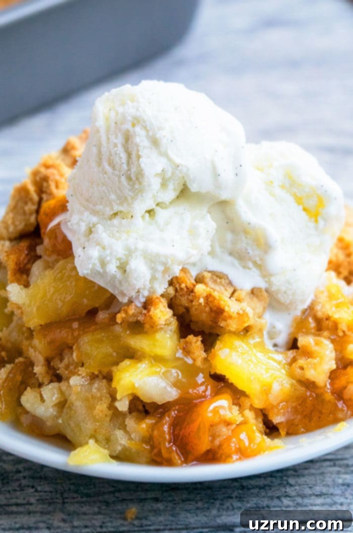 No-Fuss Peach Crumble Cake 3 Peach Dump Cake With Cake Mix in White Dish.