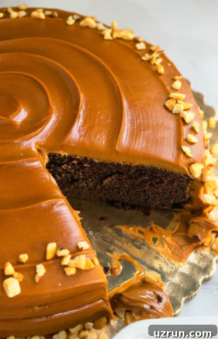 Ultimate Chocolate Caramel Indulgence 3 Homemade Caramel Cake With One Slice Removed.