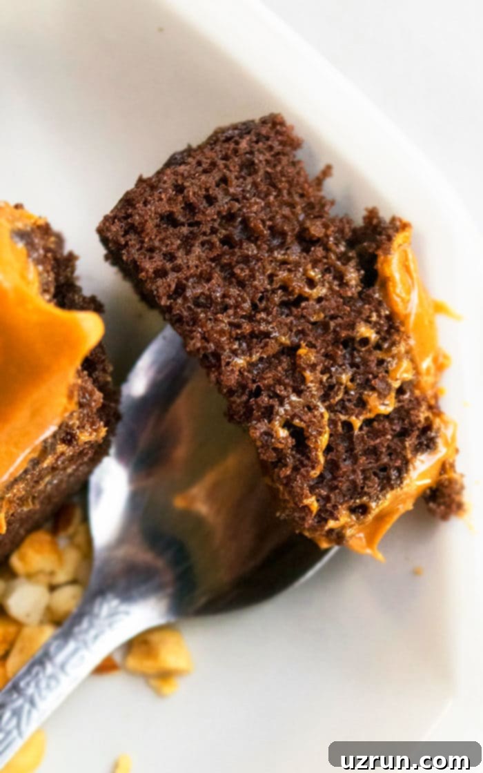 Ultimate Chocolate Caramel Indulgence 5 Fork Full of Cake on White Dish.
