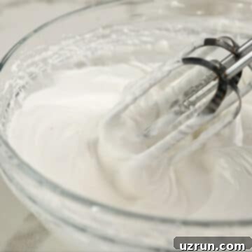 Lemon Meringue Pie That Never Weeps 9 Meringue topping being whipped in glass bowl.