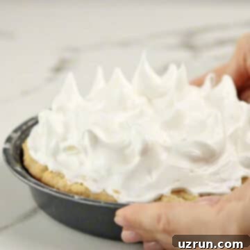Lemon Meringue Pie That Never Weeps 10 Meringue topping spread on top of pie.