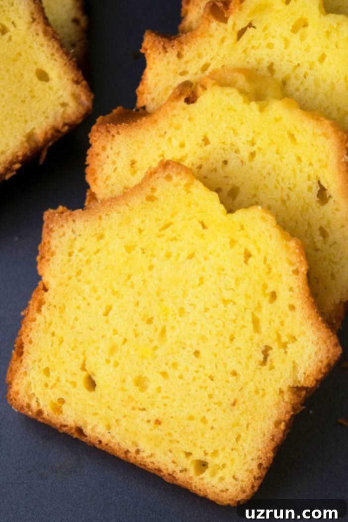 Slices of Lemon Pound Cake With Cake Mix on Gray Tray. 