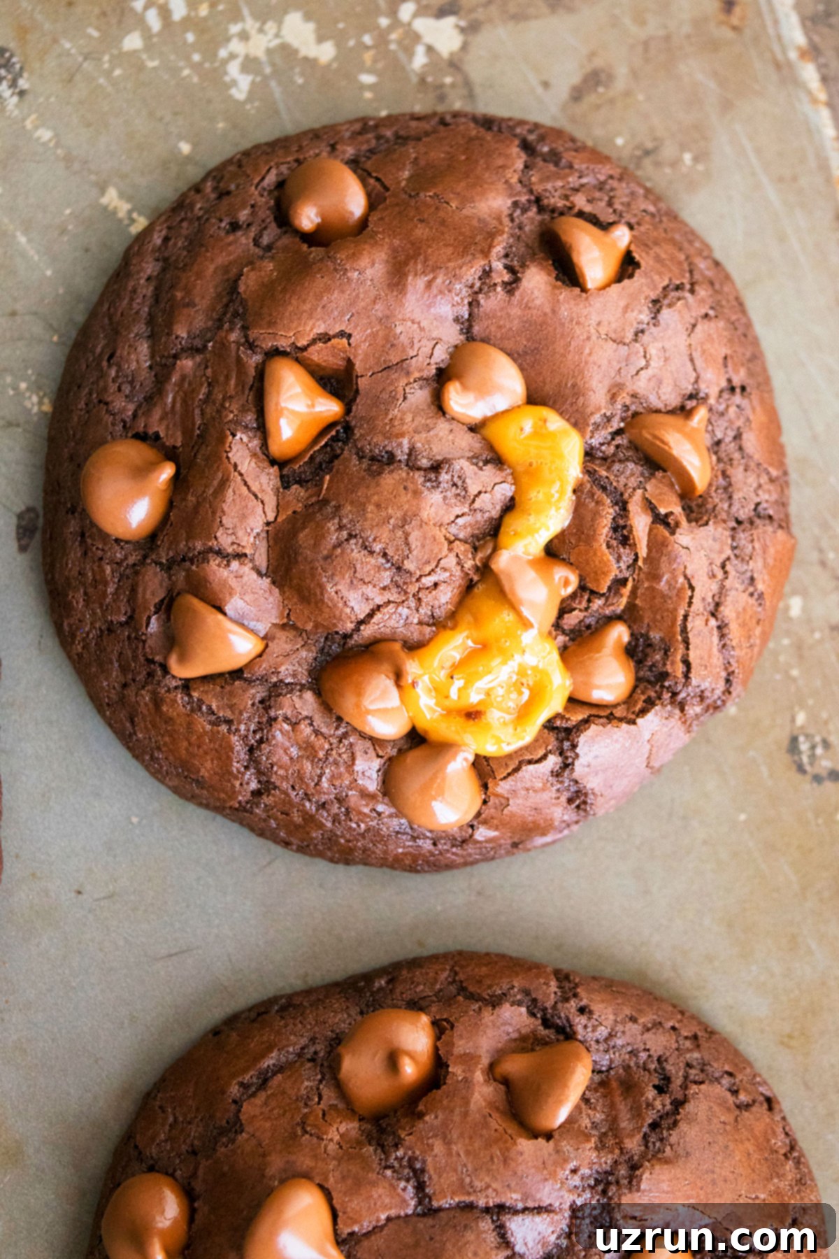 Stuffed Chocolate Caramel Cookies 4 Easy Caramel Cookies With Chocolate Chips on Baking Tray- Overhead Shot.