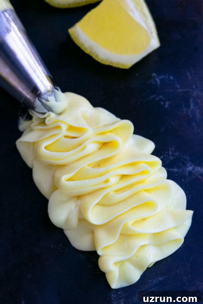 Sunshine Lemon Frosting 4 Lemon Cream Cheese Frosting Piped on Rustic Black Background