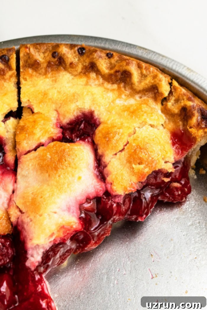 Easy Homemade Cherry Pie Sliced in Aluminum Pie Dish