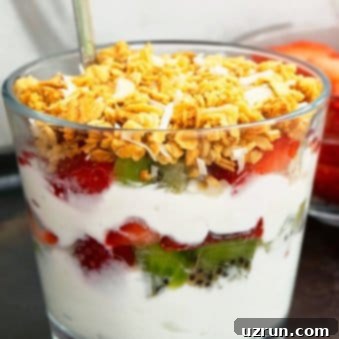Simple Layered Yogurt Delight 5 Homemade Yogurt Parfait in Glass Cup With Fresh Fruits and Granola Layers.