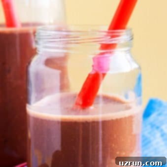 Chocolate Banana Smoothie 4 Chocolate Banana Smoothie in Mason Jar With Red Straw.