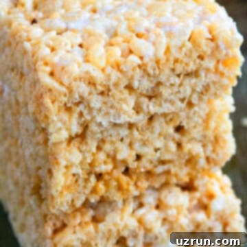 The Ultimate Guide to Perfect Rice Krispie Treats 13 Stack of Best Rice Krispie Treats on Gray Background.