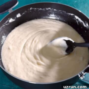 The Ultimate Guide to Perfect Rice Krispie Treats 6 Melted marshmallow mixture in nonstick pot.