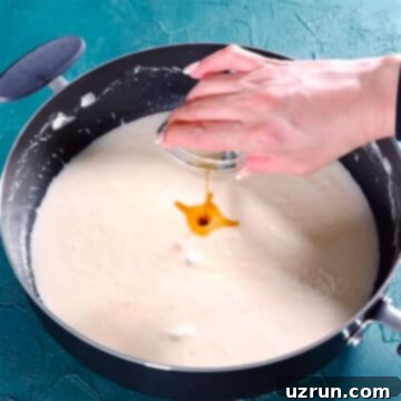 The Ultimate Guide to Perfect Rice Krispie Treats 7 Vanilla extract being added to melted marshmallows.