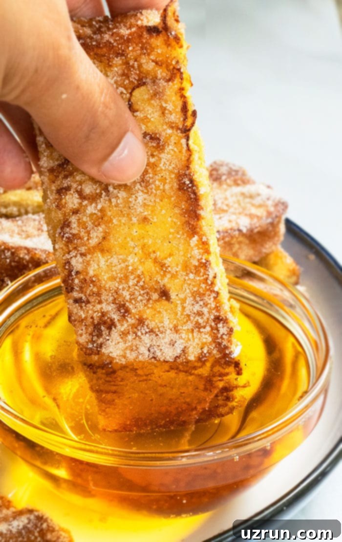 Homemade Cinnamon French Toast Sticks 3 French Toast Sticks Dipped in Maple Syrup - Delicious golden brown sticks with syrup