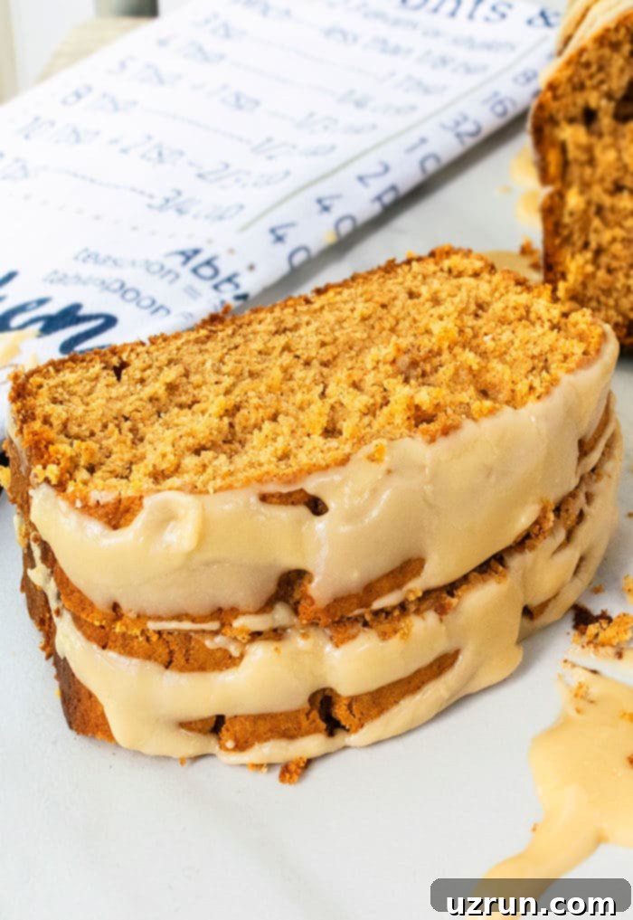 Simple Cake Mix Pumpkin Bread 5 Stack of Slices of Cake Mix Bread on White Marble Background.