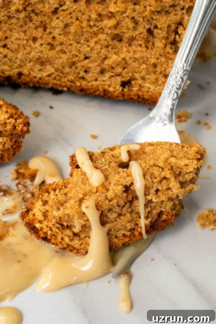 Simple Cake Mix Pumpkin Bread 7 Fork Full of Bread With Maple Glaze.