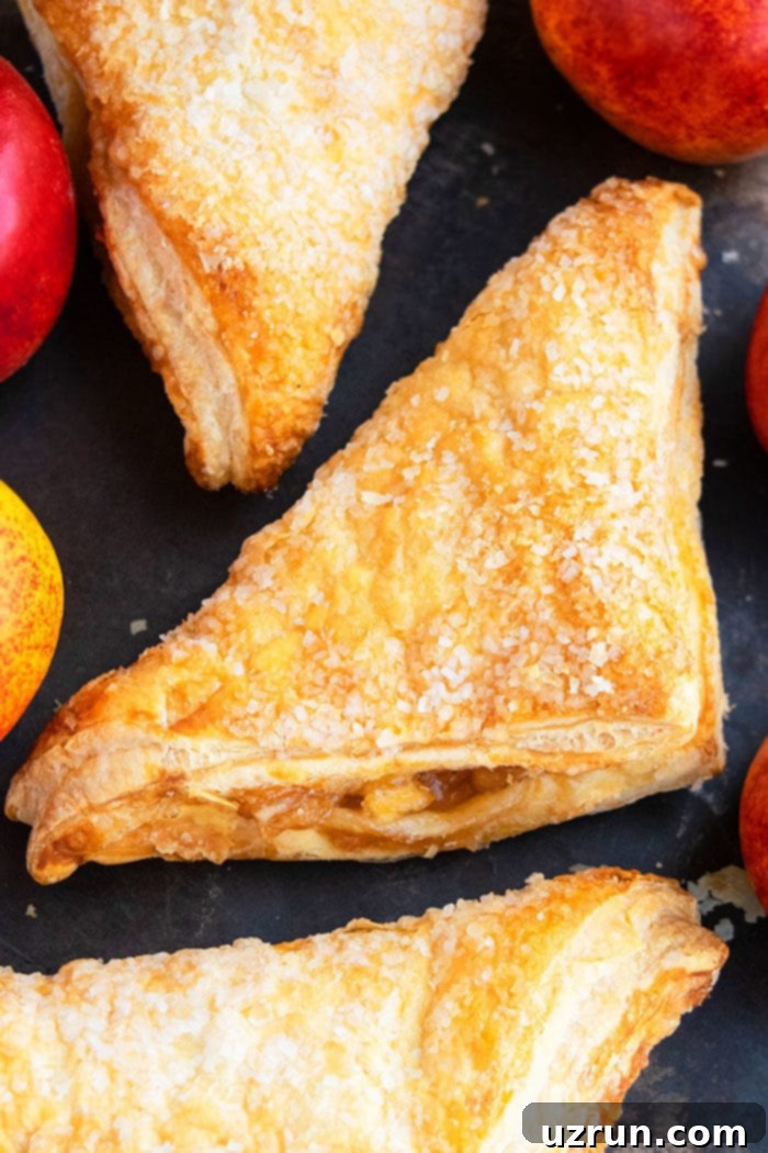 Easy Apple Turnovers on Dark Baking Tray. 