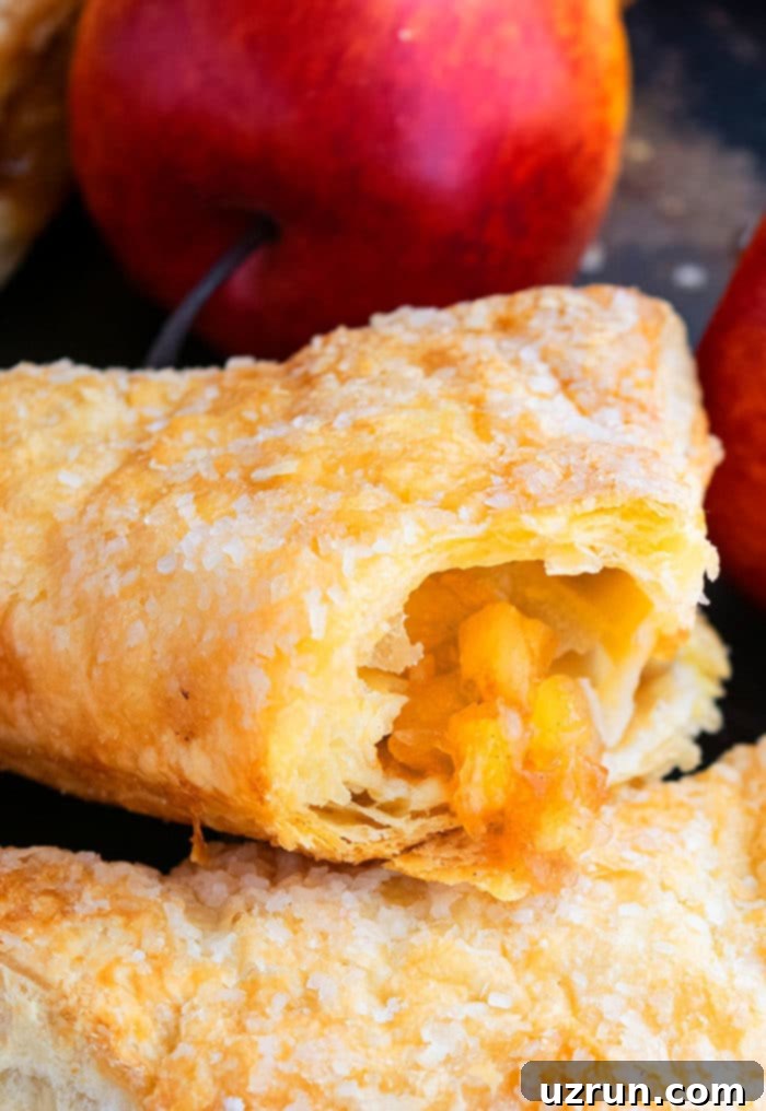 Flaky Apple Turnovers with Puff Pastry 3 Partially Eaten Puff Pastry Turnover- Closeup Shot.