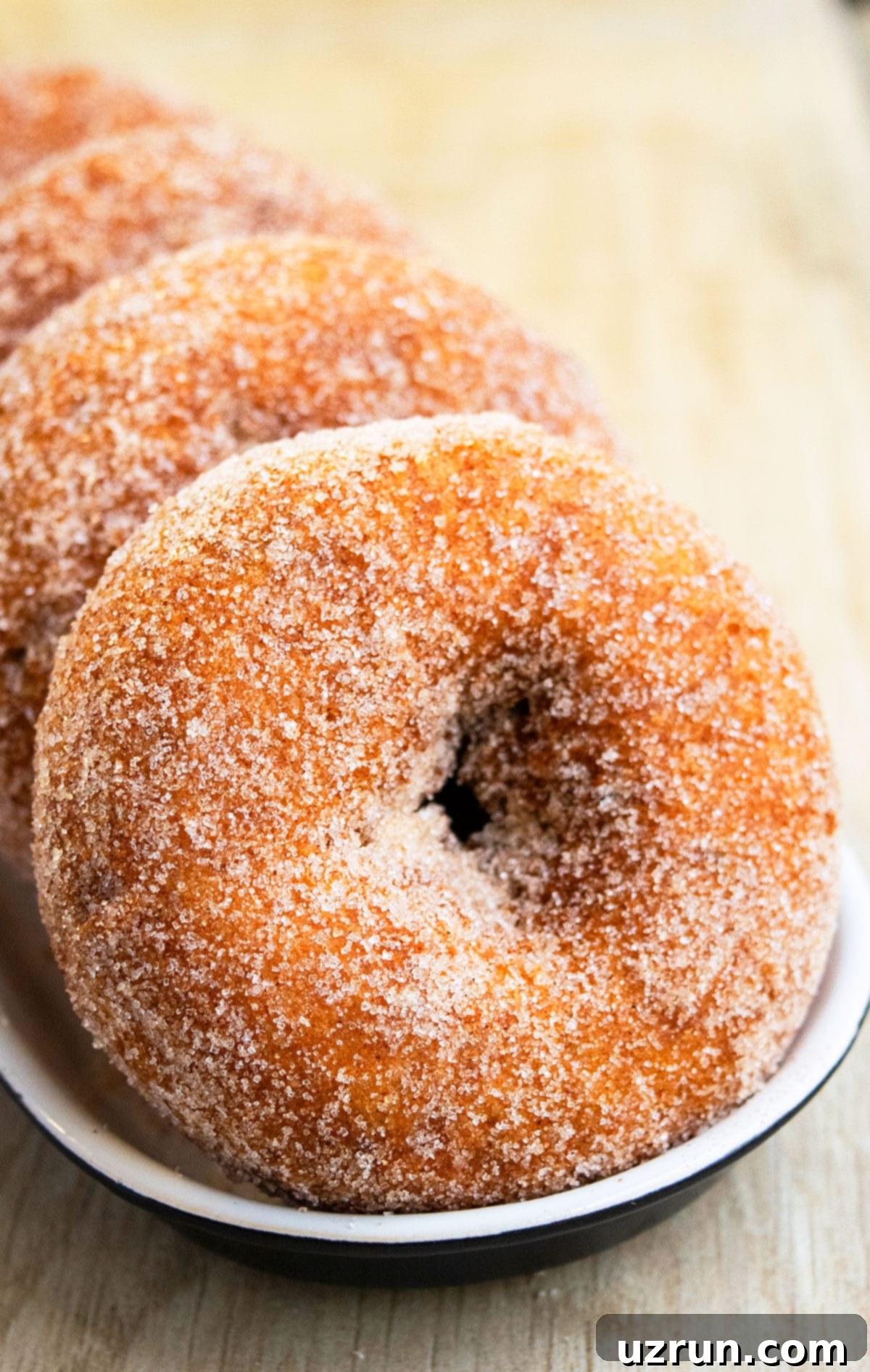 Easy Baked Apple Cider Donuts in Black and White Dish. 