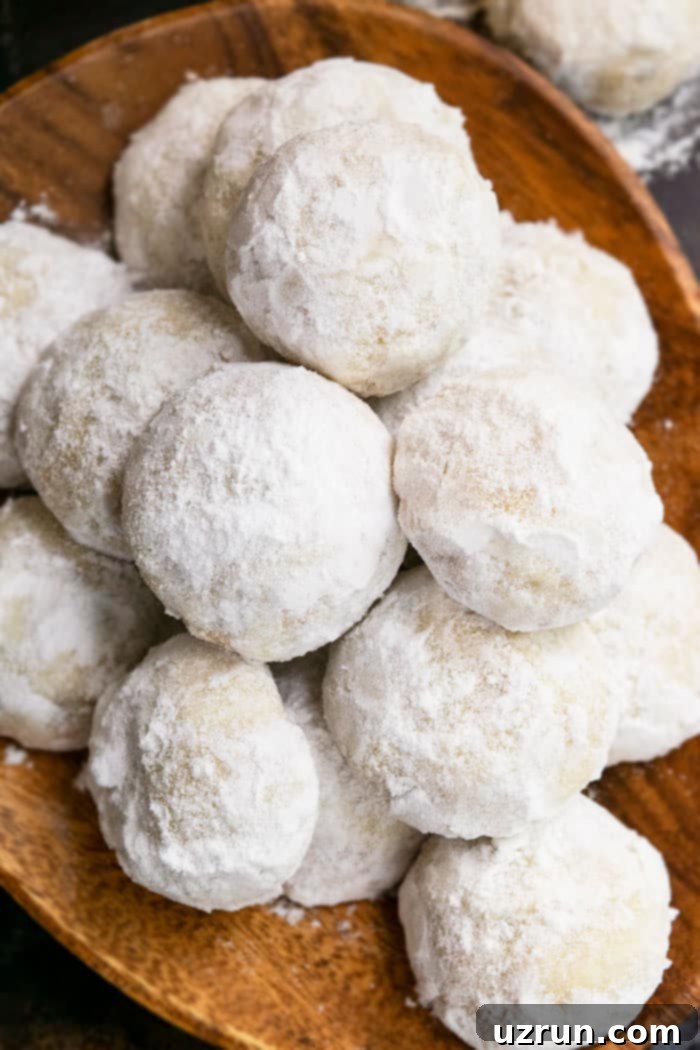Easy Pecan Snowball Cookies Recipe, homemade with simple ingredients and coated in powdered sugar.