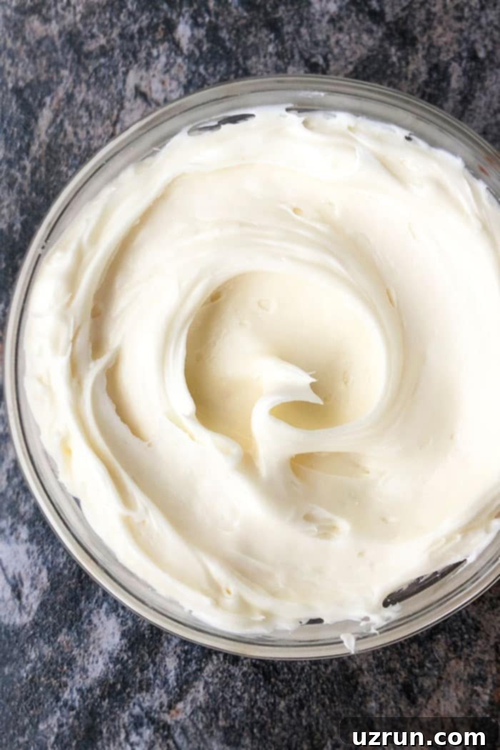 The Ultimate Easy Sugar Cookie Frosting 4 Glass Bowl of Vanilla Buttercream Icing For Cookies.