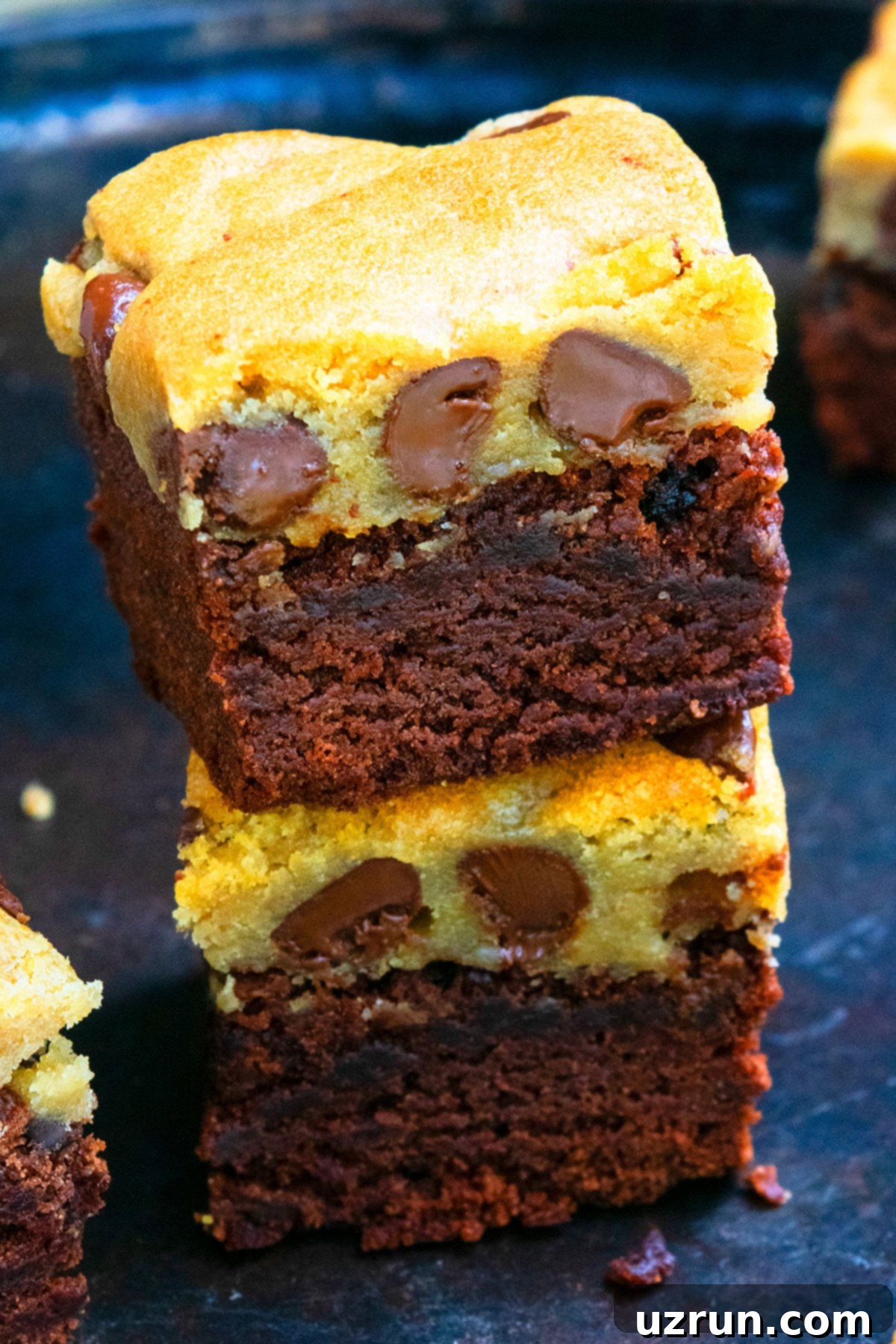 Easy Brookies with Brownie Mix 12 Stack of Homemade Loaded Bars on Dark Metal Tray.