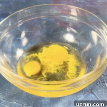 Easy Brookies with Brownie Mix 4 Eggs, oil and water in a glass bowl.