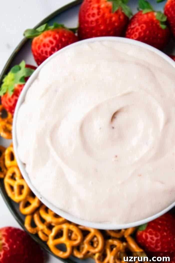 Sweet Marshmallow Cream Cheese Fruit Dip 4 Easy Pink Fruit Dip with Marshmallow Fluff, Cream Cheese, Cool Whip in White Bowl