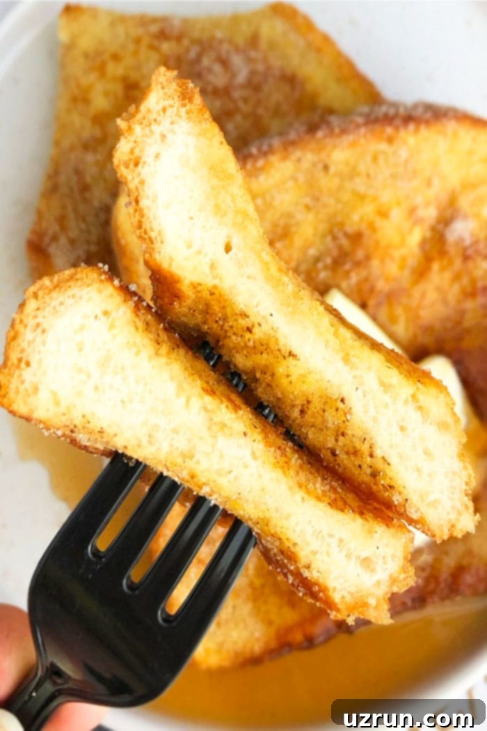 Quick Cinnamon French Toast 4 Closeup of Homemade French Toast on Black Fork