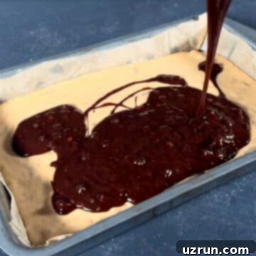Box Mix Caramel Brownies 9 Brownie batter being poured on top of caramel layer.