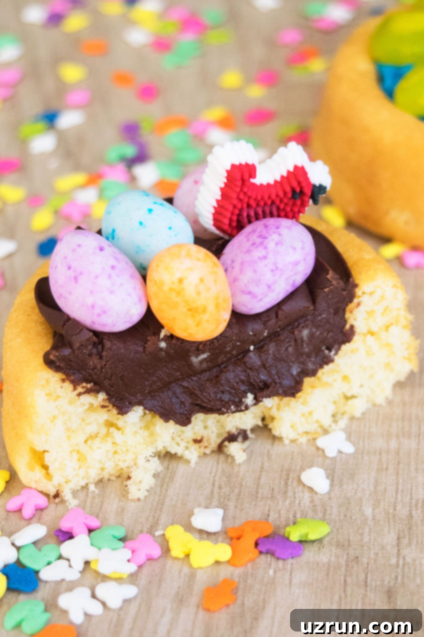 Creative Easter Cake Ideas 4 Partially eaten mini Easter cake on a rustic wood background, showcasing its delicious layers.