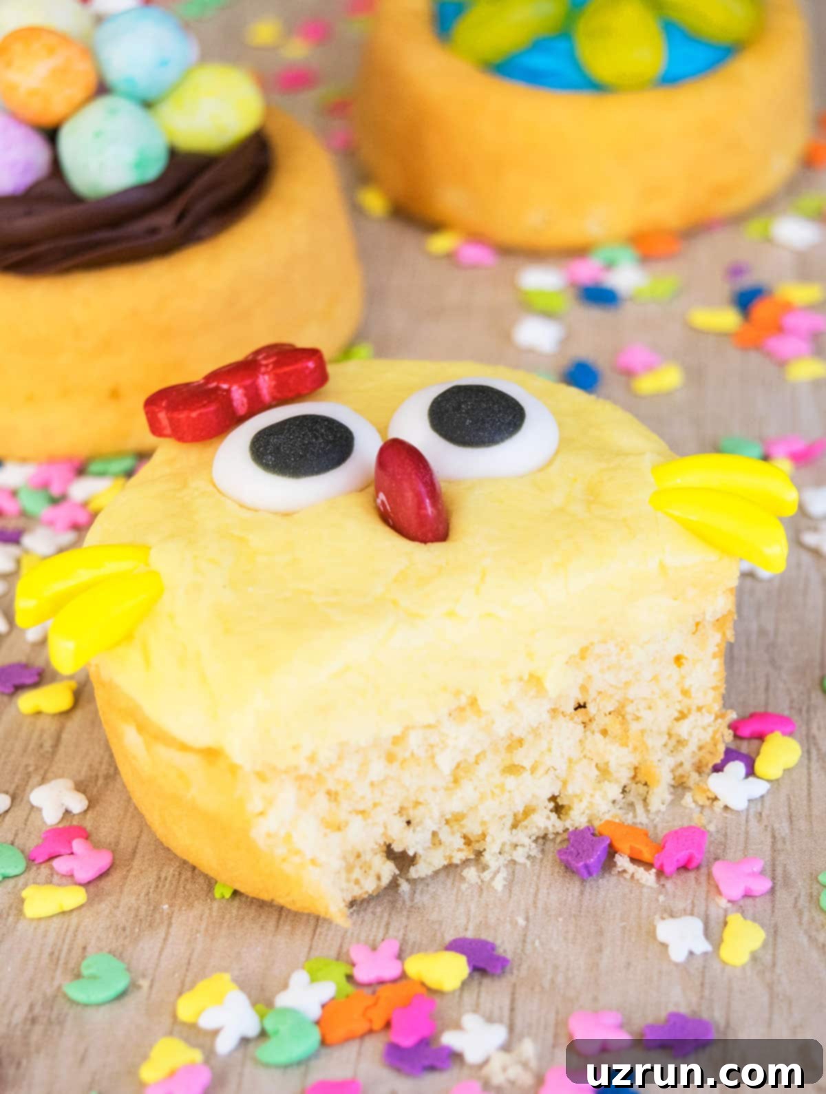 Creative Easter Cake Ideas 7 Partially Eaten Mini Cake on Wood Background, showcasing the vibrant decorations.
