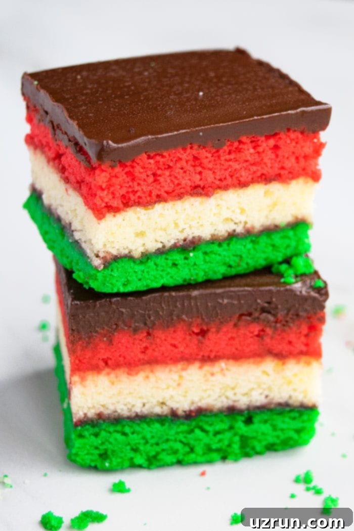 Vibrant Italian Rainbow Almond Delights 2 Stack of Easy Homemade Italian Rainbow Cookies on White Background