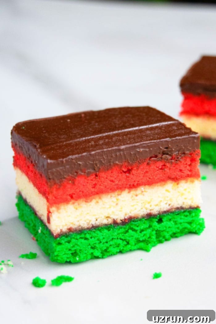 Vibrant Italian Rainbow Almond Delights 4 Closeup Shot of Tri Color Italian Flag Cookie on White Background
