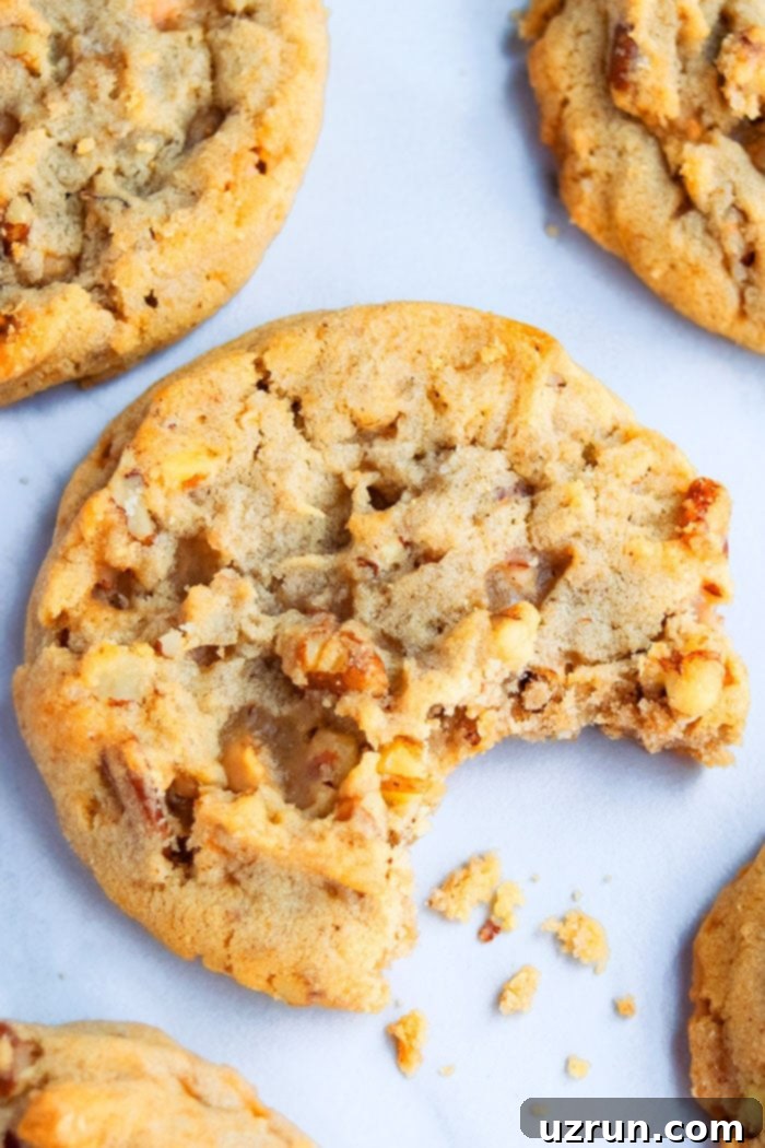 Buttery Pecan Perfection 3 Soft and Chewy Pecan Cookies with Bite Removed